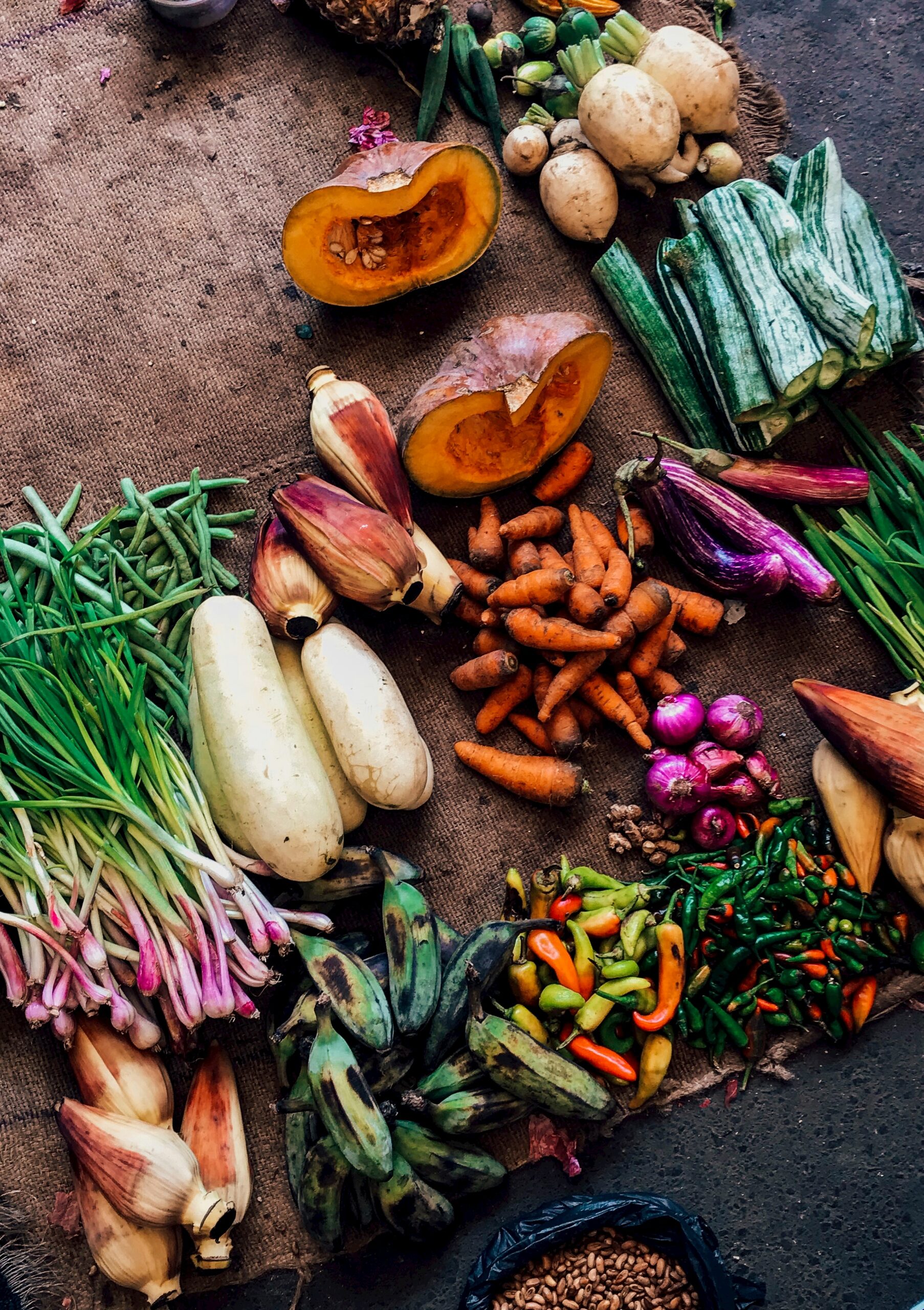 assorted vegetables on brown textile